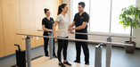 Armedica adjustable parallel bars featuring a motorized digital display and heavy-gauge stainless steel rails for elite therapy.