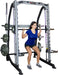 Smith Trainer featuring free bar safety catches and integrated weight holders for controlled workouts