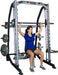 Smith Trainer featuring free bar safety catches and integrated weight holders for controlled workouts