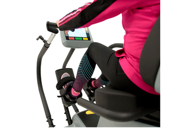 The PhysioStep LXT recumbent cross trainer featuring an oversized swivel seat and linear stepping pedals for easy access.