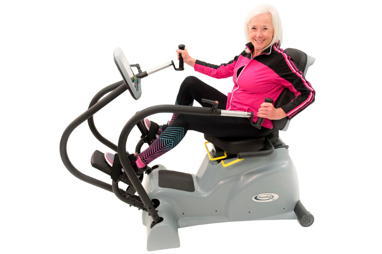 The PhysioStep LXT recumbent cross trainer featuring an oversized swivel seat and linear stepping pedals for easy access.