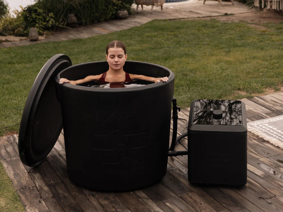 Cold plunge tub in use with connected Ice Barrel chiller for recovery and wellness
