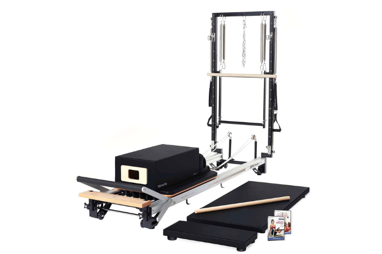 A professional SPX Max Plus merrithew pilates reformer featuring a vertical frame and sleek aluminum rails for smooth, high-performance training.