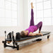 The Merrithew At Home SPX Reformer Package is a Pilates reformer machine that provides smooth resistance, adjustable settings, and a sturdy, compact design.