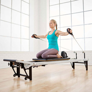 The Merrithew Elevated Pilates At Home SPX Reformer Package is a premium Pilates reformer machine that enhances strength, flexibility, and alignment, making it perfect for gyms and dedicated individuals.