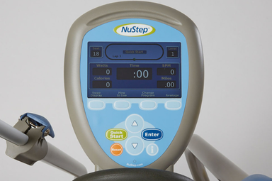 Nustep t5xr recumbent cross trainer with a reclining seat and adjustable handles for safe clinical rehabilitation sessions.