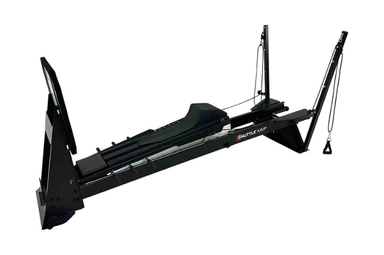 The Shuttle MVP shuttle exercise machine featuring a PNF Total Body Tower for integrated arm and leg conditioning.