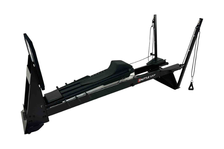 The Shuttle MVP shuttle exercise machine featuring a PNF Total Body Tower for integrated arm and leg conditioning.