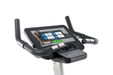 Spirit CU800ENT commercial upright bike featuring a 15.6 inch touchscreen entertainment console and heavy-duty frame.