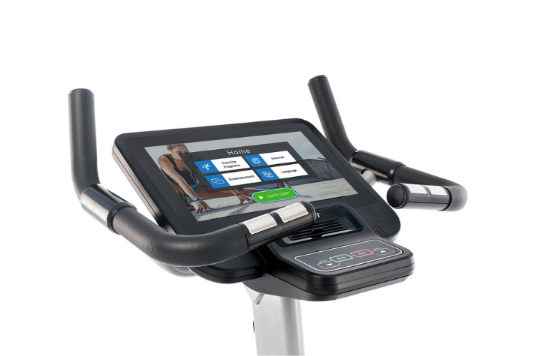 Spirit CU800ENT commercial upright bike featuring a 15.6 inch touchscreen entertainment console and heavy-duty frame.