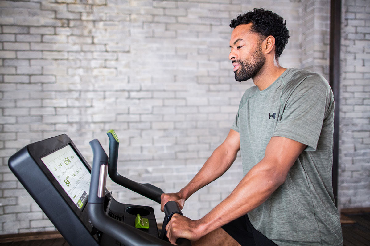 SportsArt C576U Status Upright Stationary Bike with 16" Senza touchscreen for precision workouts and premium fitness training