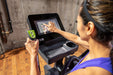 The SportsArt Low Impact Elliptical Machine E874 Elite with 13" Senza Touchscreen provides durable, joint-friendly cardio training with advanced performance features.