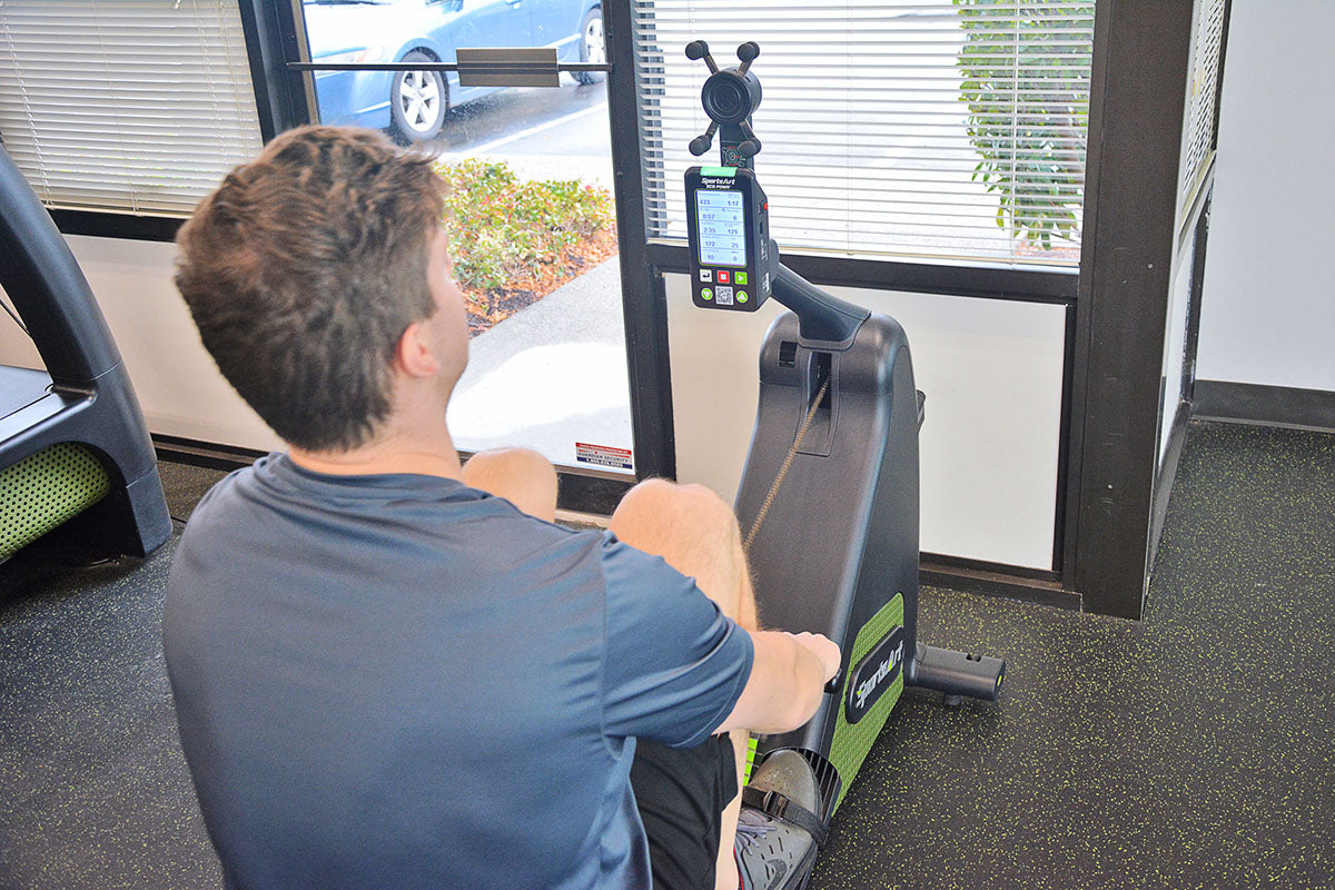 SportsArt G260 is an indoor rower with ergonomic foot pedals and wireless resistance for efficient commercial rowing workouts.