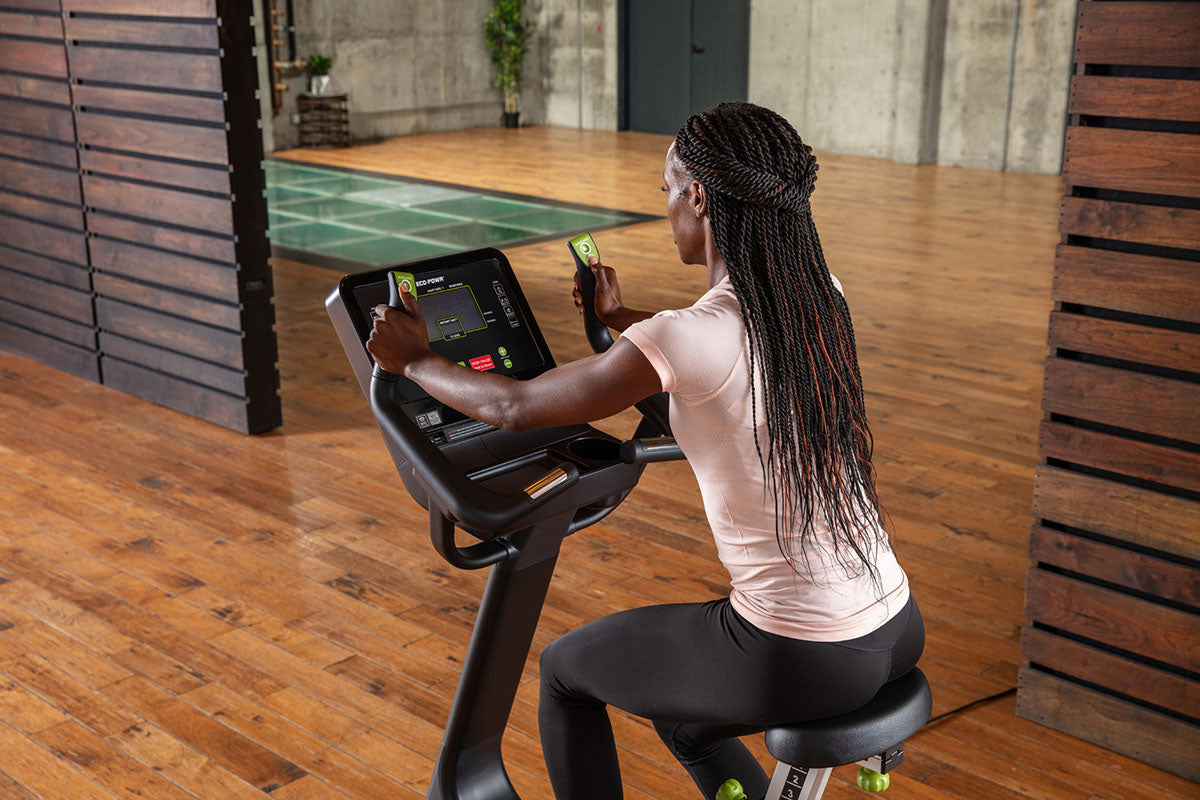 The SportsArt G574U Elite Eco-Powr is an upright stationary bike that boosts endurance, burns calories, and improves cardiovascular health.