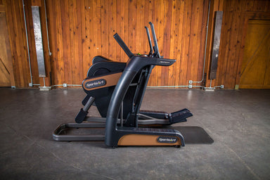 The SportsArt Cross Trainer V886 Verso Status Eco-Natural is a heavy-duty cross trainer machine designed for gyms and dedicated individuals