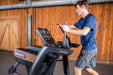 The SportsArt Cross Trainer V886 Verso Status Eco-Natural is a heavy-duty cross trainer machine offering low-impact, full-body workouts, customizable resistance, and immersive entertainment.