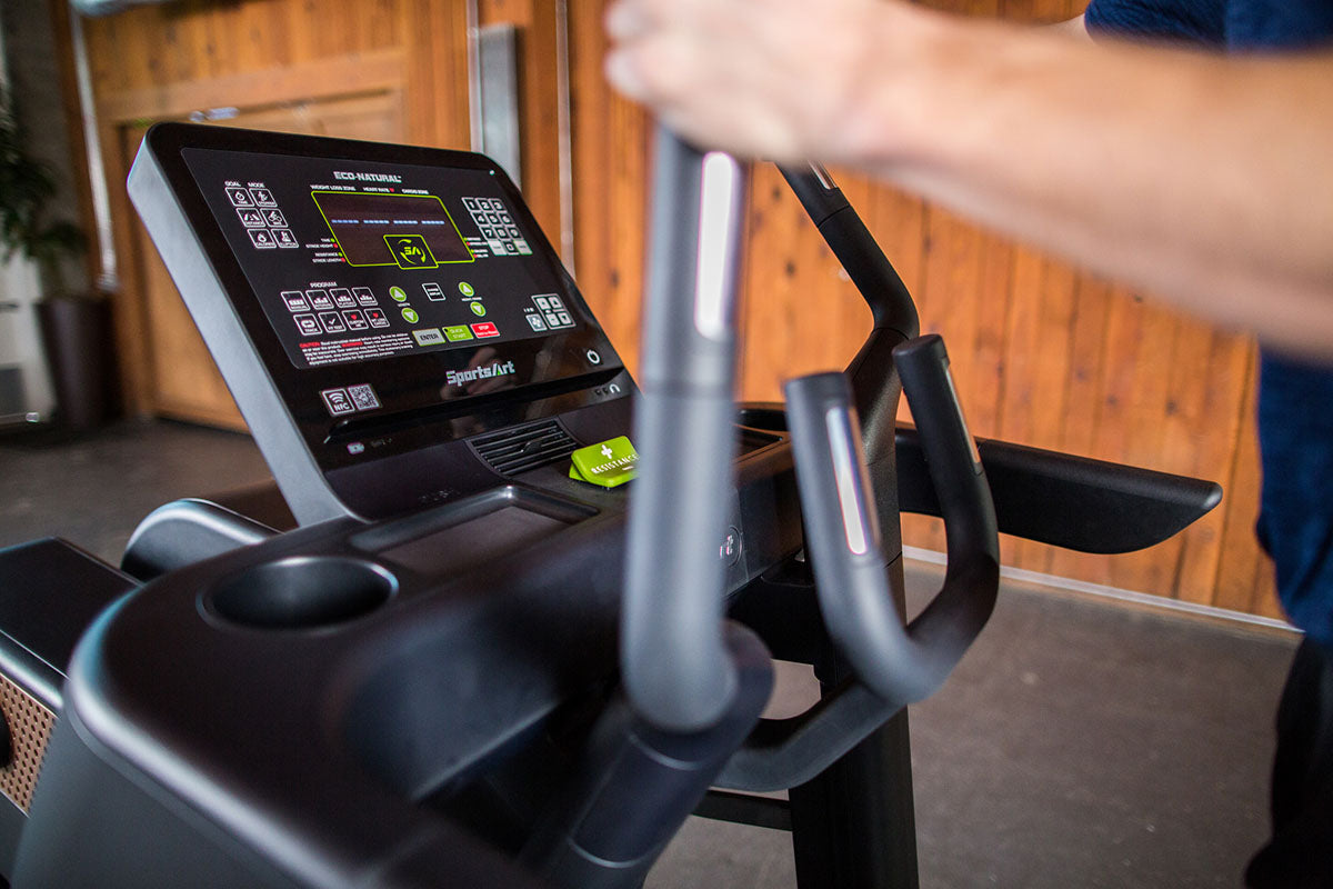 The SportsArt Cross Trainer V886 Verso Status Eco-Natural is a heavy-duty cross trainer machine offering low-impact, full-body workouts, customizable resistance, and immersive entertainment.